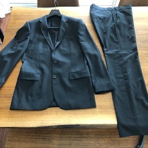 Men’s black Hugo Boss Red Label suit.